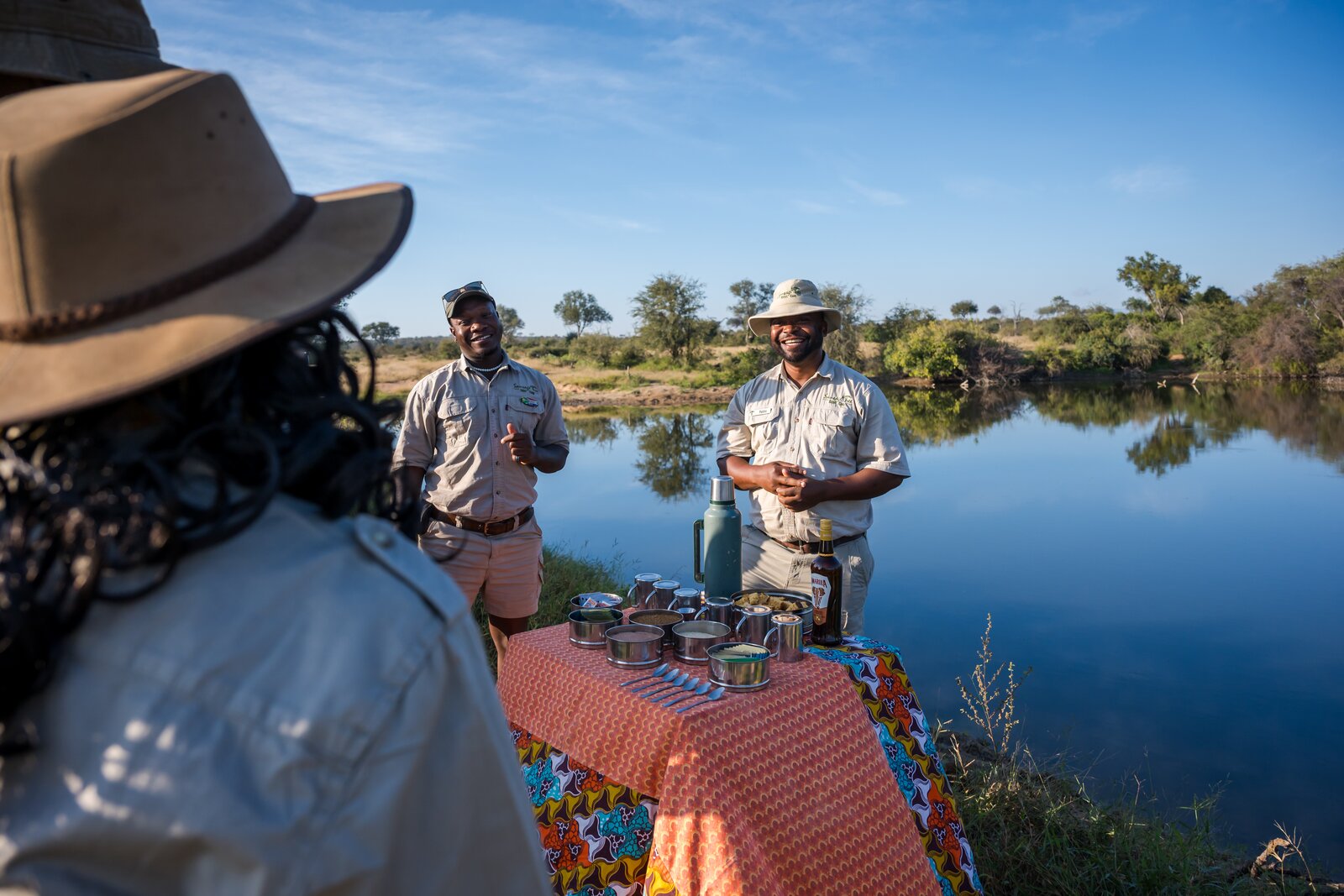 Guide on a pontoon at dusk on a sound safari